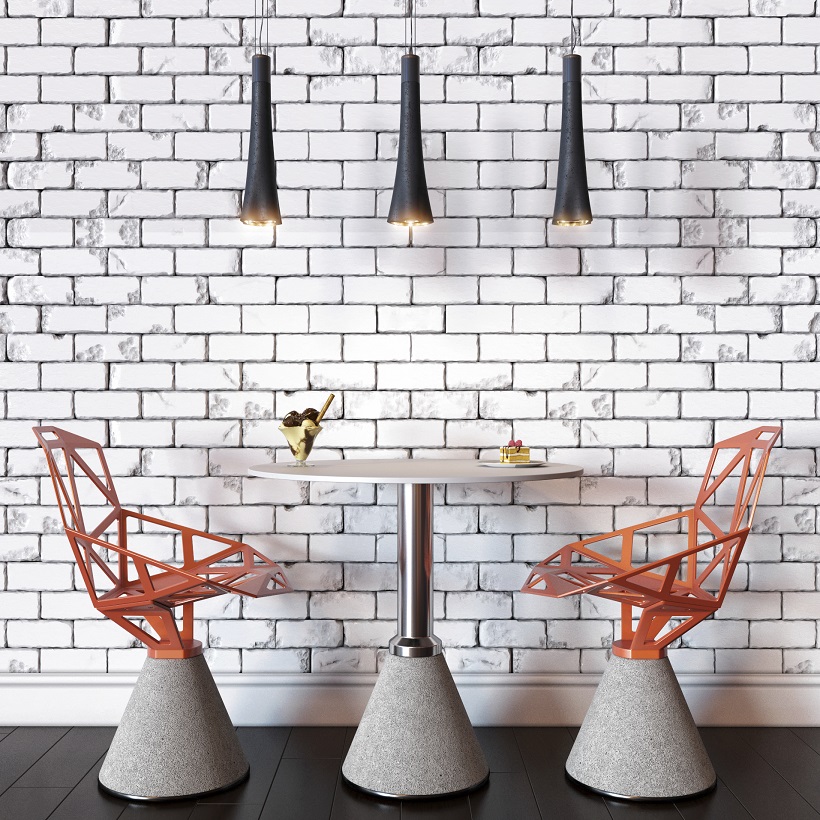 Home trends featuring a modern orange chairs against white brick wall.