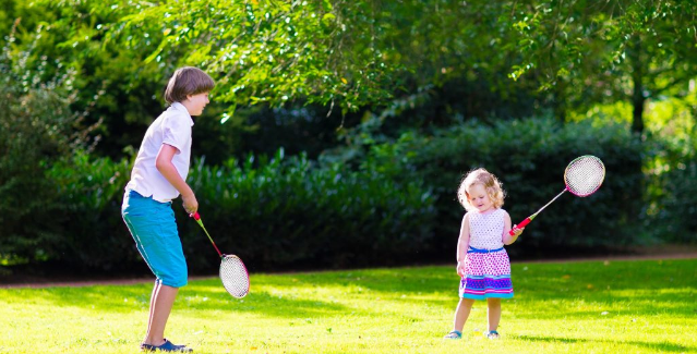 Kids playing backyard summer games