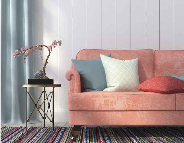 Shades of the summer color trend, coral, on home décor like couch and pillows