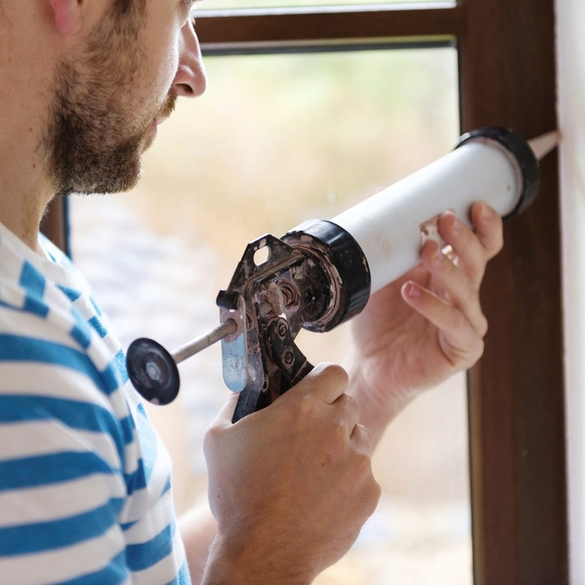 Caulking windows as one of the top home maintenance tips