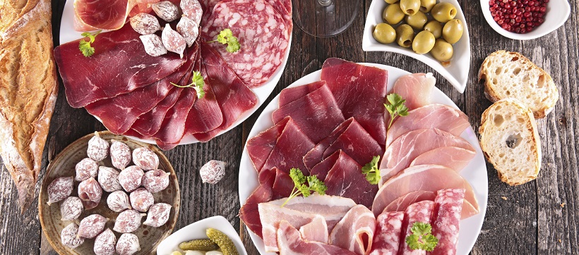 An appetizer spread of cheese and meats for a housewarming party