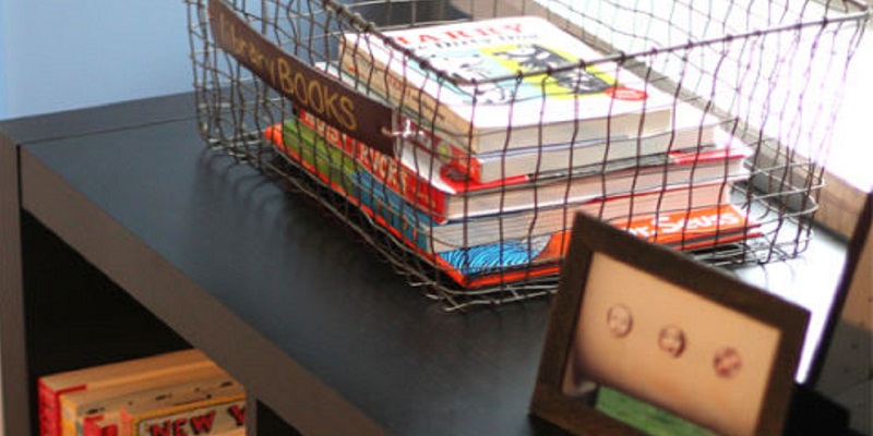 A back-to-school library station at home with baskets and shelves for school books.