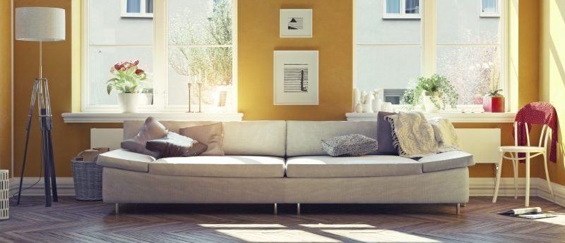 Sun shining in an orange living room with summer home décor
