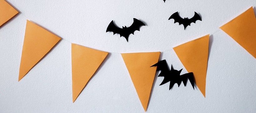 Orange triangle banner and black fake bats for Halloween home décor ideas