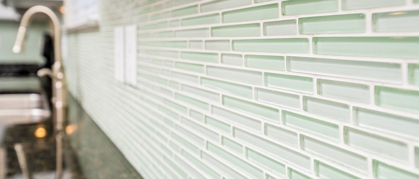 Close-up of mint green backsplash in the kitchen of a new Austin home