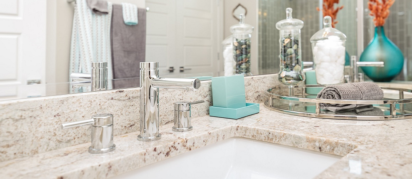 White granite forming modern bathroom vanity in a new Austin home