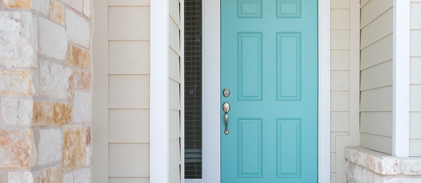 Exterior of home with stone and siding surrounding a bright, light blue front door.