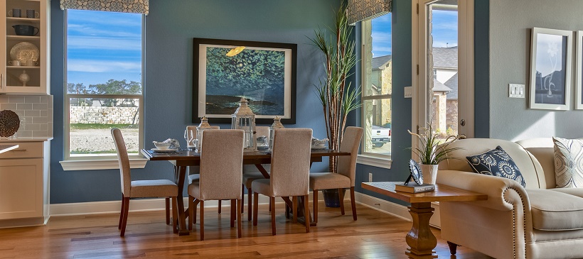 View of blue dining room near living room in this Cedar Park real estate option at The Park at Brushy Creek