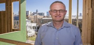 MileStone CEO, Garrett Martin, smiling for picture with city of Austin in the background.