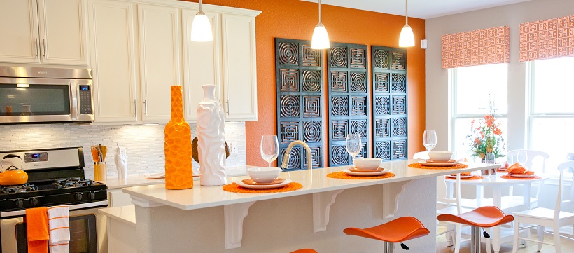 The orange-and-white kitchen of one of the best coming-soon home options in Austin.