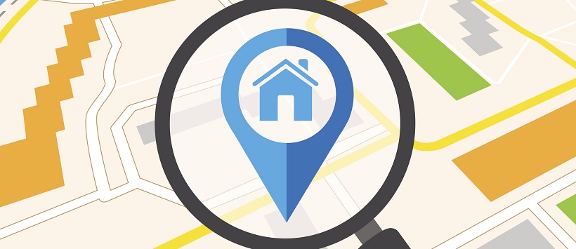 Vector image of a map with a magnifying glass enlarging a home icon.