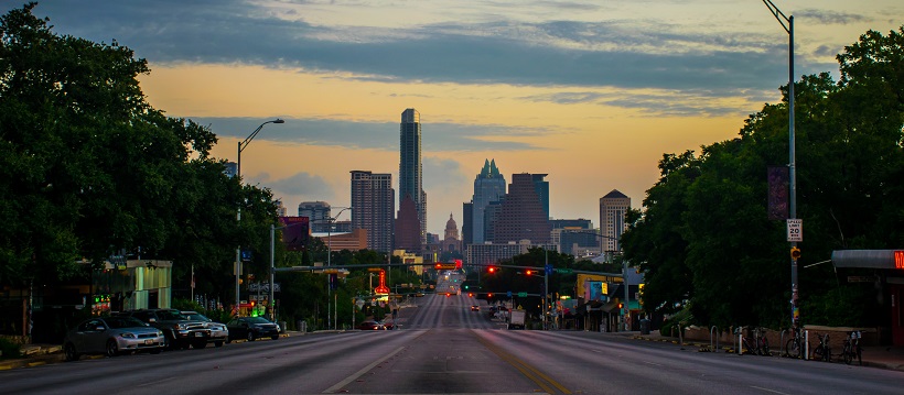 At sunset, view of downtown Austin and the capitol from the middle of South Congress.