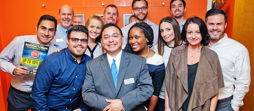 MileStone Community Builders sales team smiling at camera after a talk on buying homes in Austin, Texas.