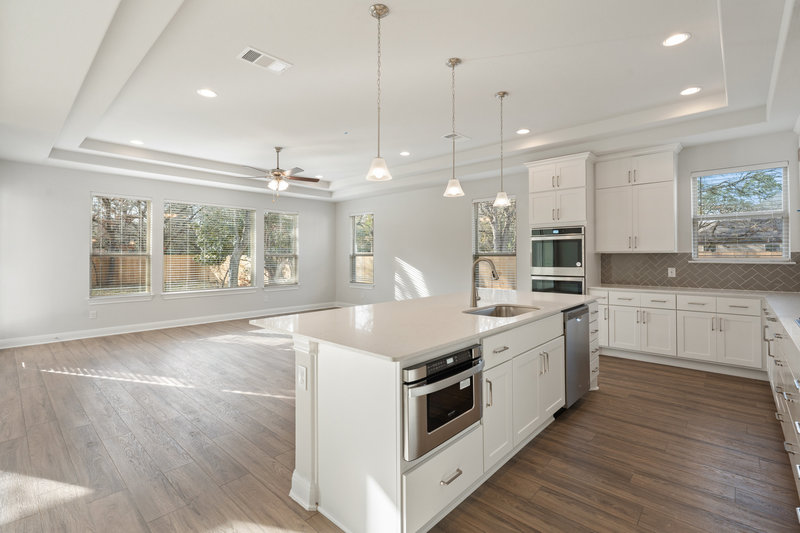 kitchen island living room Austin Homes for Sale New Homes Austin Milestone Home Builder Blog